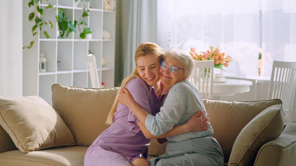 Compassionate in-home caregiver in La Mesa, CA, assisting a senior with daily activities and companionship.